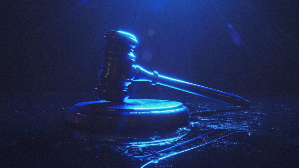 Glowing blue gavel representing FDA regulatory verdicts and final decisions, as Aldeyra reproxalap faces PDUFA judgment Tuesday following BioCryst pediatric Orladeyo approval, Innoviva Zoliflodacin gonorrhea approval, and year-end binary catalysts creating discriminating market rewarding only perfect execution in final full trading week 2025